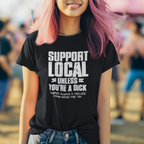 Person wearing a black t-shirt with 'Support Local Unless You're a Dick' text, standing outdoors.