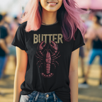 Person wearing a black t-shirt with a lobster graphic and 'BUTTER' text, standing outdoors.