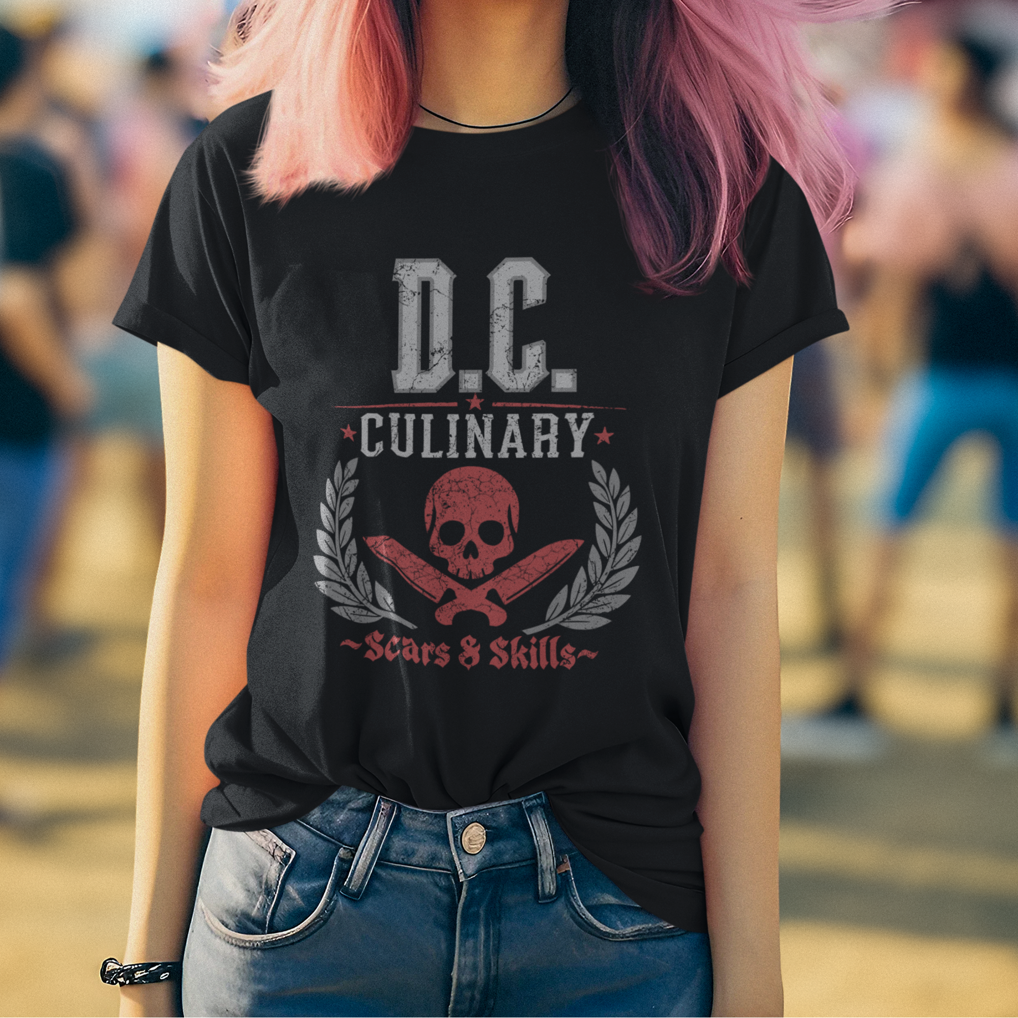 Person wearing a black t-shirt with 'D.C. Culinary' design, standing outdoors with blurred background