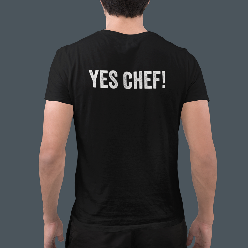 Person wearing a black t-shirt with 'YES CHEF!' text on the back against a dark background