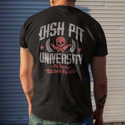 A man viewed from behind wearing a black graphic t-shirt with a distressed white and red 'OHSH PIT UNIVERSITY' design on the back, standing in front of a corrugated metal garage door.