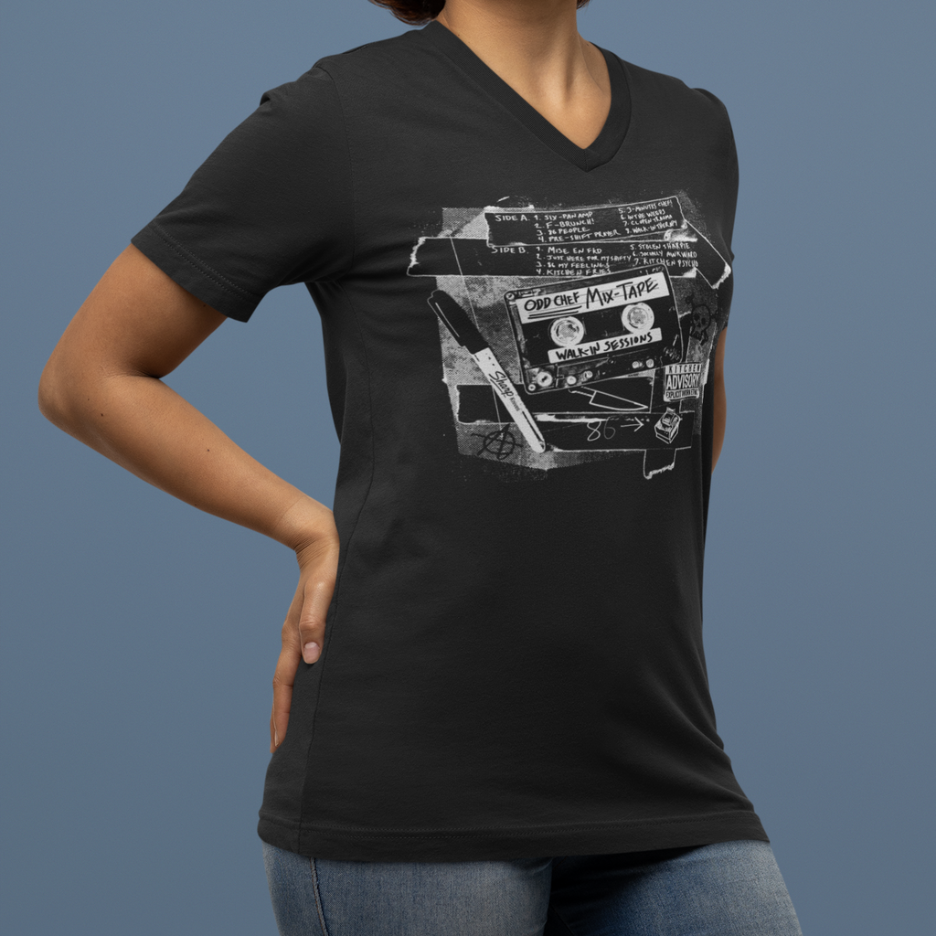 Person wearing a black t-shirt with a graphic design on a blue background
