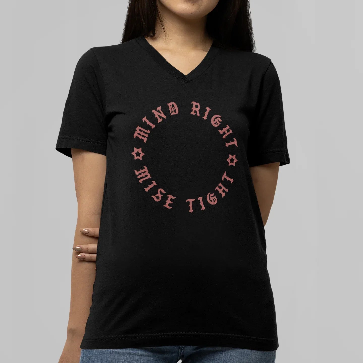 Person wearing a black t-shirt with red text on a gray background