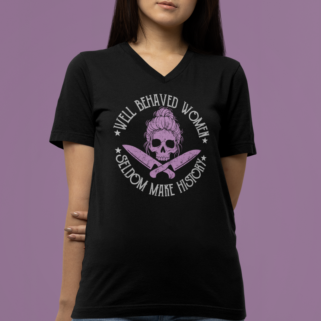 Person wearing a black t-shirt with a graphic design and text against a purple background