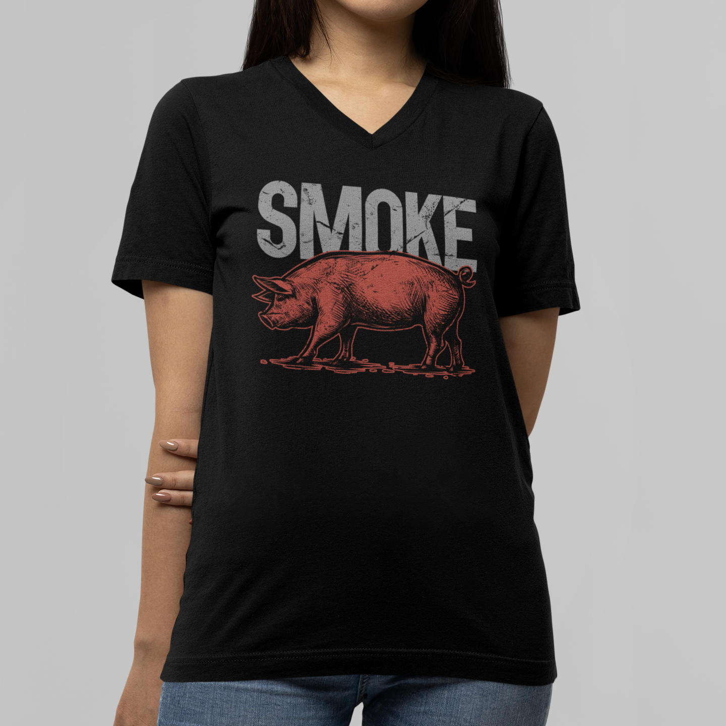 Person wearing a black t-shirt with a graphic design and text on a plain background