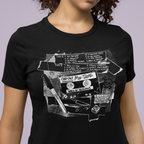Person wearing a black t-shirt with a graphic design of a cassette tape and text.