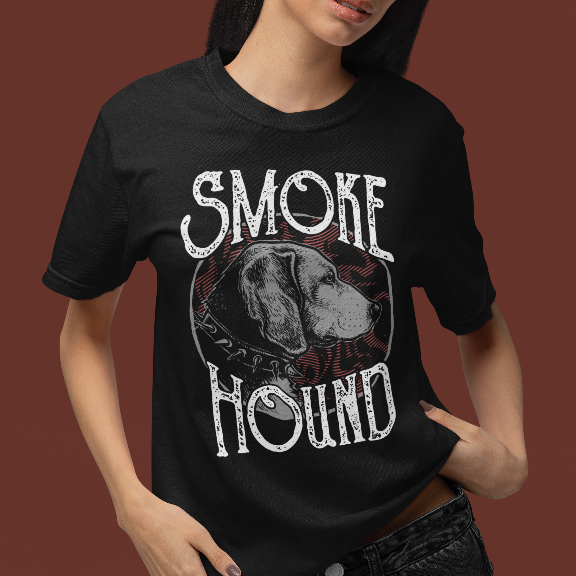 Person wearing a black t-shirt with 'Smoke the Hound' graphic design on a brown background