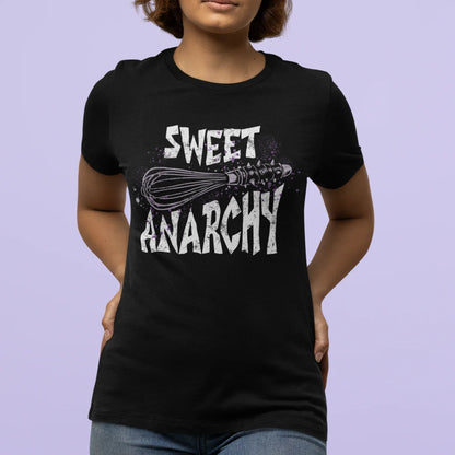 Person wearing a black t-shirt with 'Sweet Anarchy' design on a light purple background
