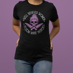 Person wearing a black t-shirt with a graphic design and text on a purple background