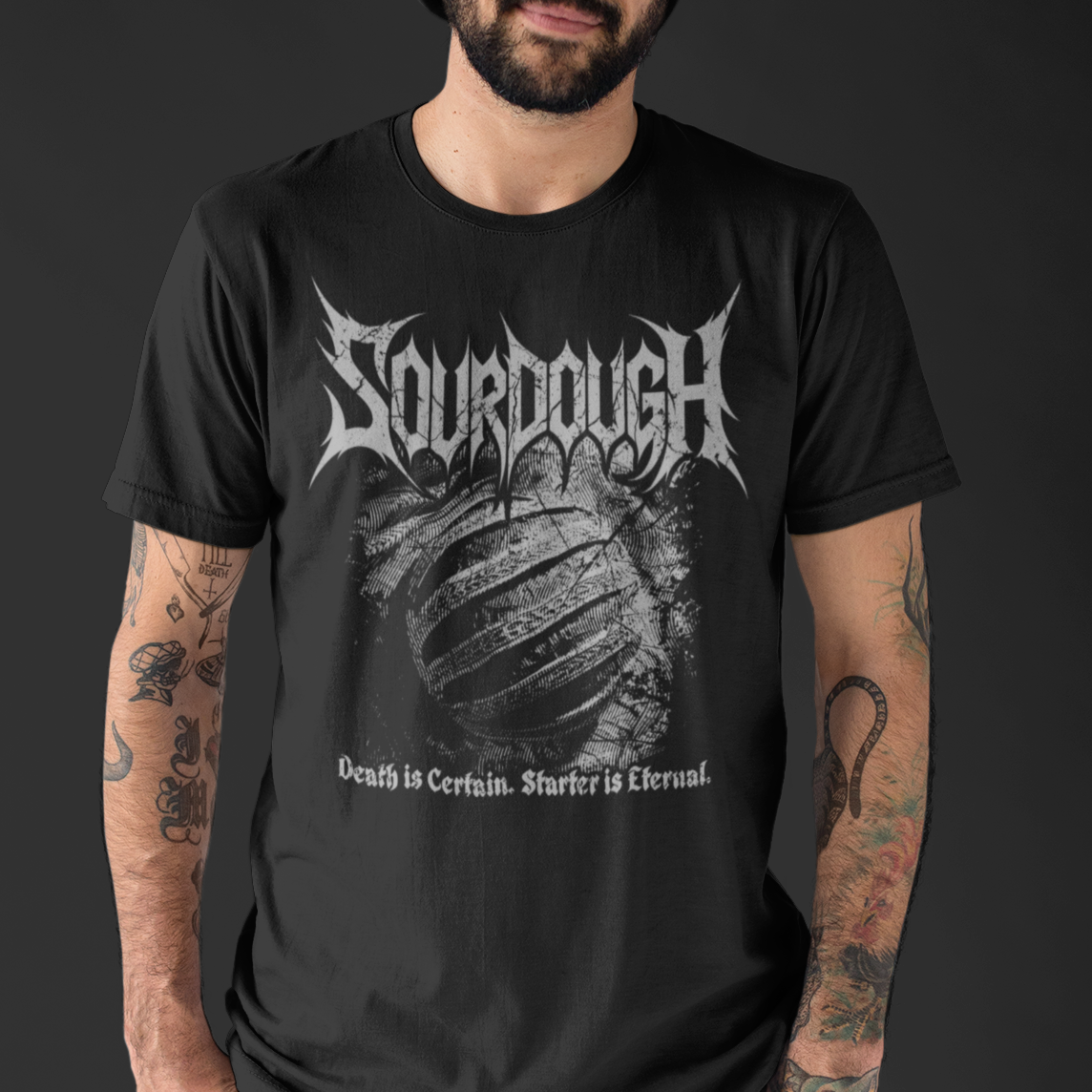 Man wearing a black t-shirt with 'Sourdough' design and text on a dark background