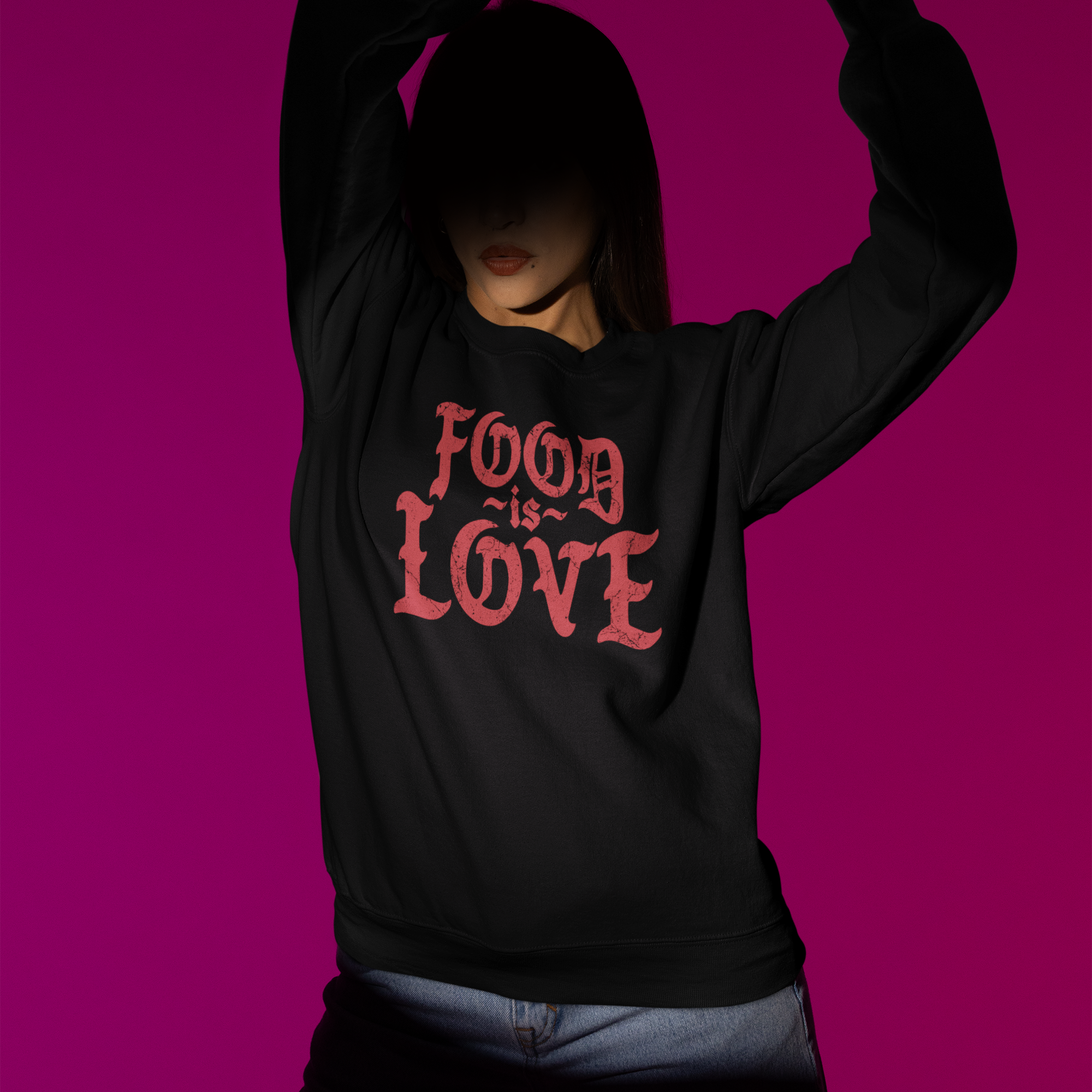 Person wearing a black hoodie with 'FOOD IS LOVE' text on a purple background