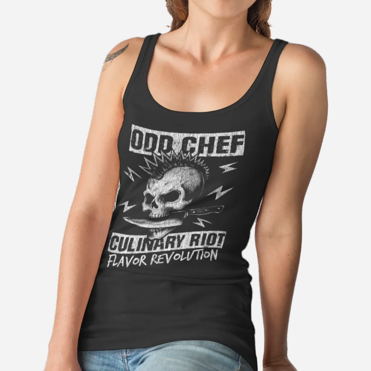 A woman wearing a black racerback tank top with a distressed white graphic that reads 'ODD CHEF' and 'CULINARY RIO! FLAVOR REVOLUTION' around a skull illustration, against a plain white background.