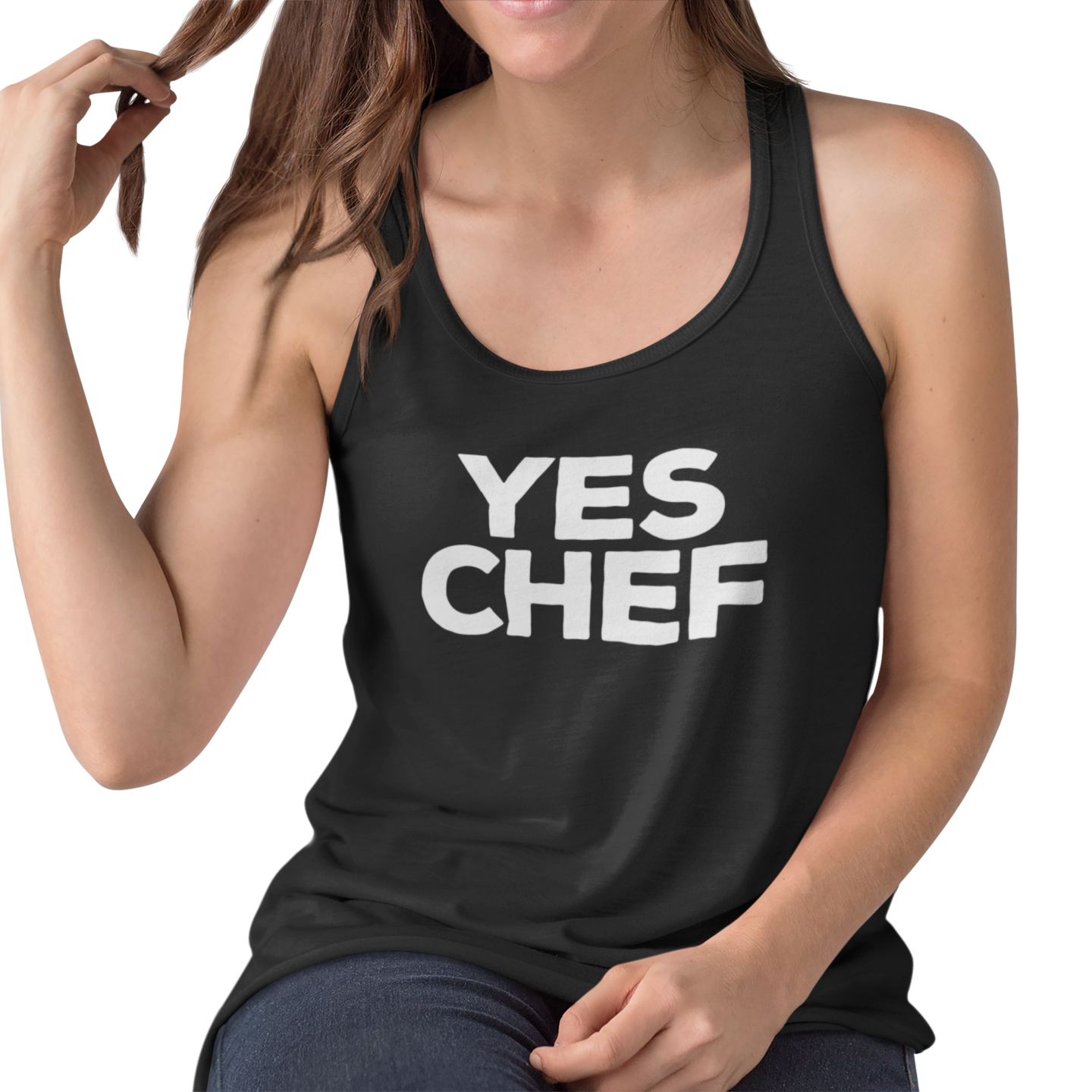Person wearing a black tank top with 'YES CHEF' text on a white background