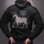 Person wearing a black hoodie with a graphic design on the back, standing against a gray background