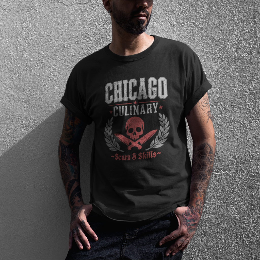 Man wearing a black t-shirt with 'Chicago Culinary' design against a gray wall