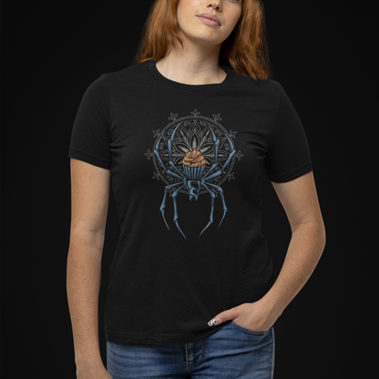 A woman wearing a black short-sleeve t-shirt with a blue spider graphic on the front, paired with blue jeans, set against a solid black background.