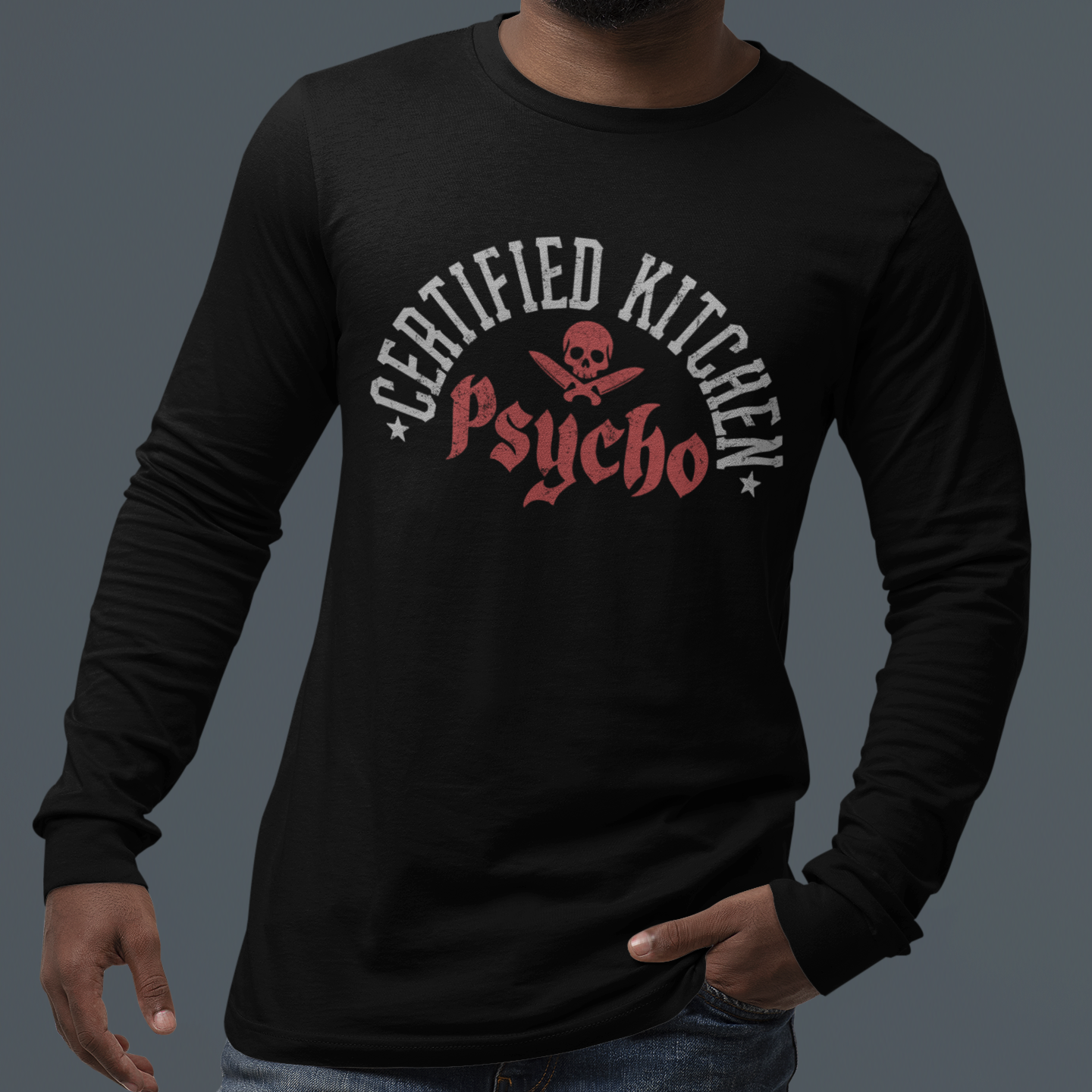 Person wearing a black long-sleeve shirt with 'Certified Kitchen Psycho' design on a dark background