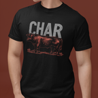 Person wearing a black t-shirt with a graphic of a cow and the word 'CHAR' on a brown background