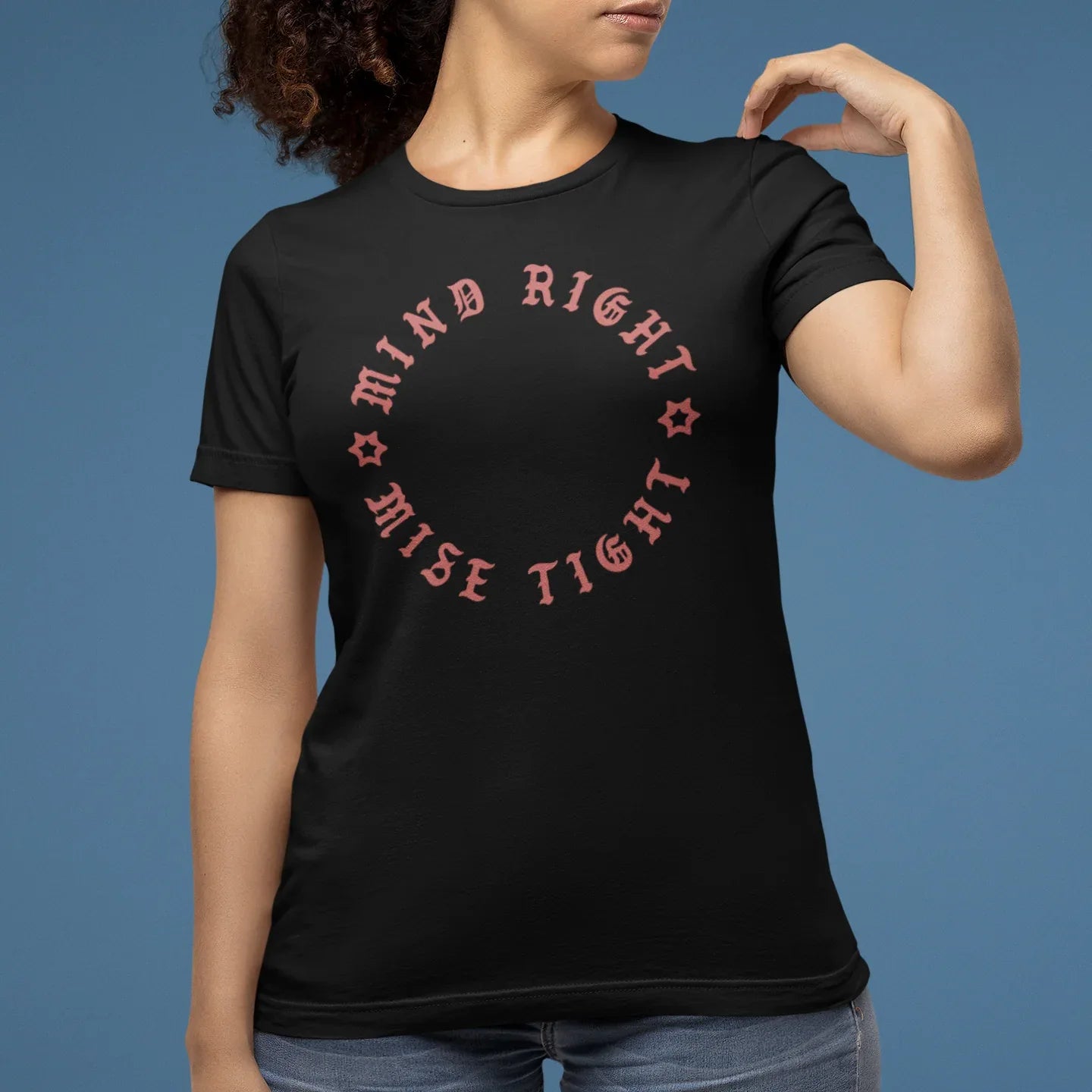 Person wearing a black t-shirt with red text on a blue background