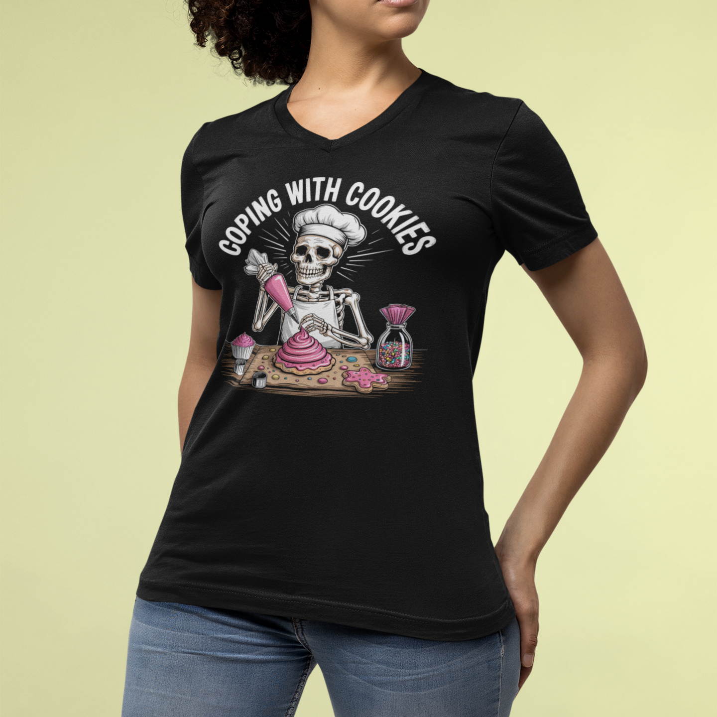 Person wearing a black t-shirt with a skeleton graphic and text on a light yellow background