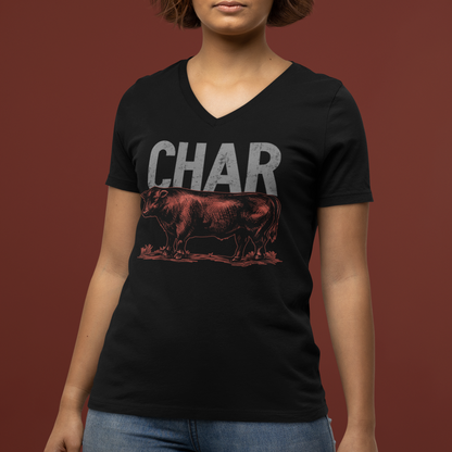 Person wearing a black t-shirt with 'CHAR' and a graphic of a steak on a brown background