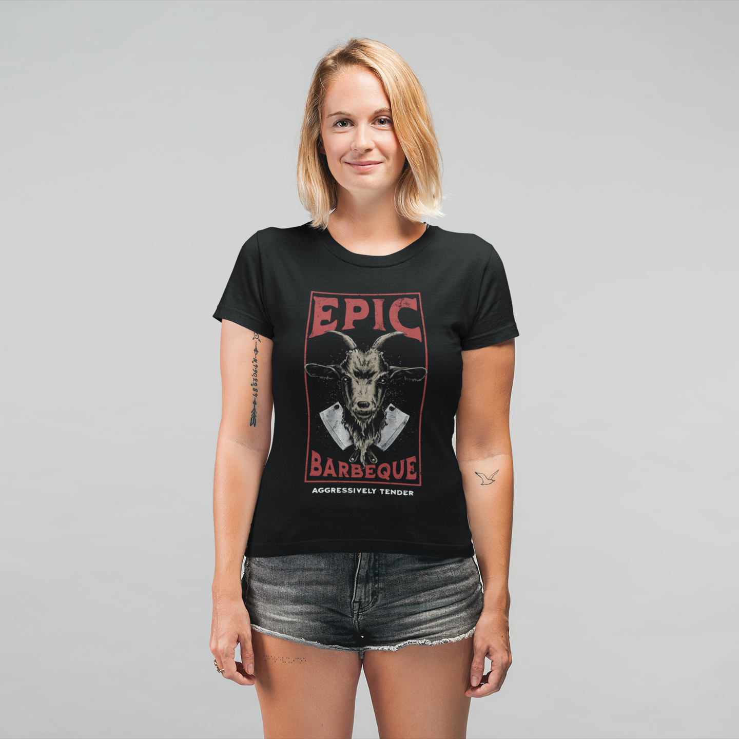 Woman wearing a black t-shirt with 'EPIC BARBECUE' graphic design on a gray background