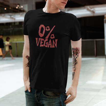 A man wearing a black crewneck t-shirt with a red graphic that reads '0% VEGAN' on the front, paired with blue jeans and white sunglasses, standing in a modern outdoor setting.