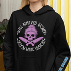 Person wearing a black hoodie with a graphic design and text.