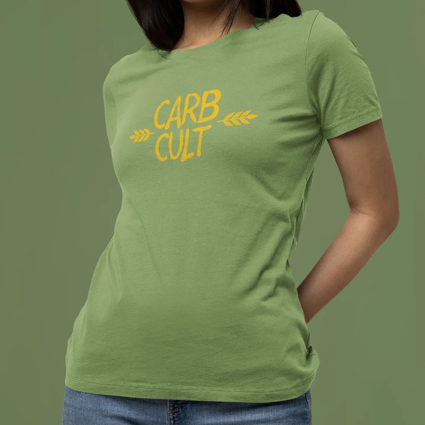 Person wearing a green t-shirt with 'CARB CULT' text on a solid background