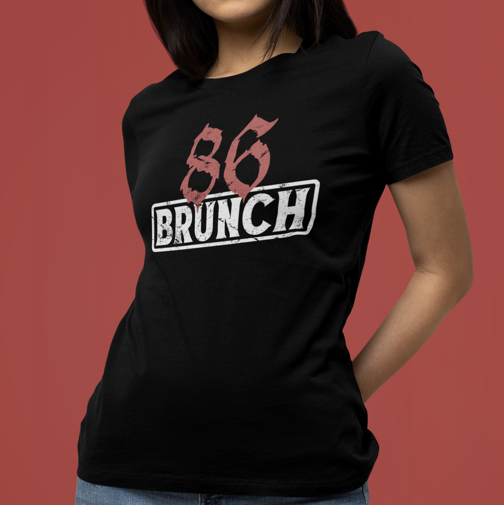 Person wearing a black t-shirt with '86 BRUNCH' text on a red background