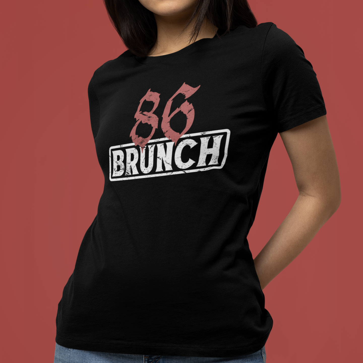 Person wearing a black t-shirt with '86 BRUNCH' text on a red background