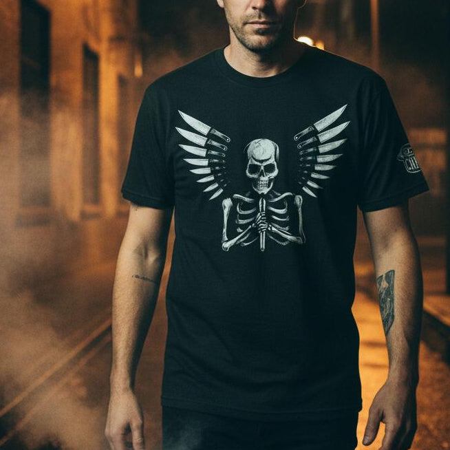 Man wearing a black t-shirt with a skeleton design in an urban setting at night.