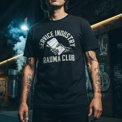 Man wearing a black t-shirt with 'Service Industry Trauma Club' graphic design in an urban setting.