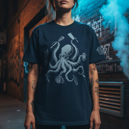 Person wearing a dark blue t-shirt with an octopus design in an urban setting.