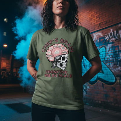 Person wearing a green t-shirt with a graphic design in an urban setting