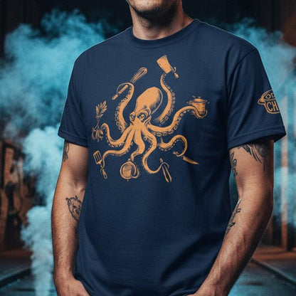 Man wearing a navy blue t-shirt with an octopus design in a dark alleyway.