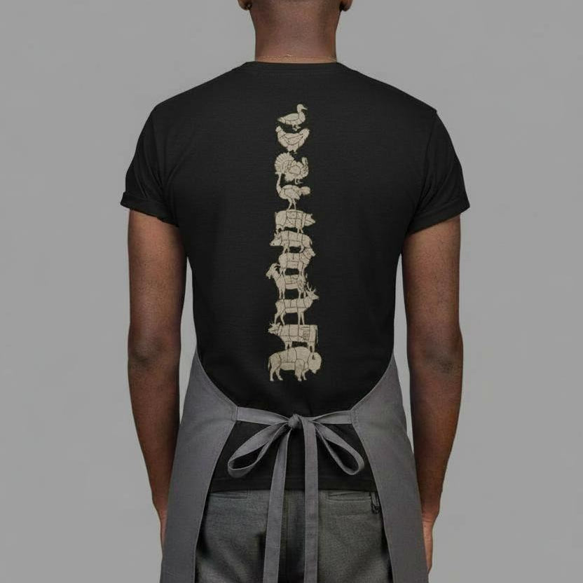 Person wearing a black t-shirt with a unique design on the back against a gray background