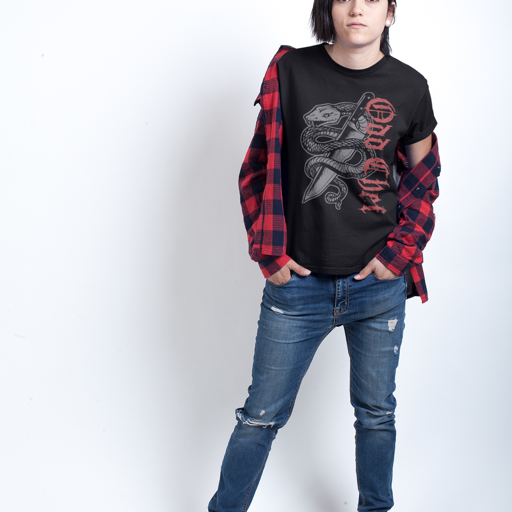 Person wearing a black t-shirt with graphic design, red plaid shirt, blue jeans, and white sneakers on a white background