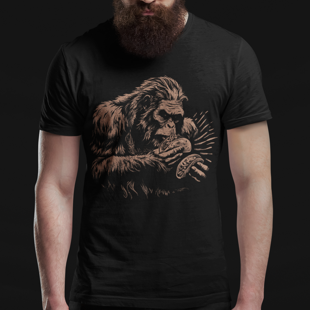 Man wearing a black t-shirt with a graphic design of an ape on a dark background