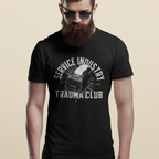 Man wearing a black t-shirt with 'Service Industry Trauma Club' text and graphic on a beige background