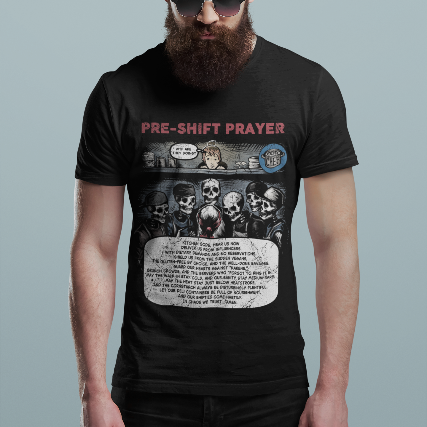 Man wearing a black t-shirt with graphic design and text on a gray background