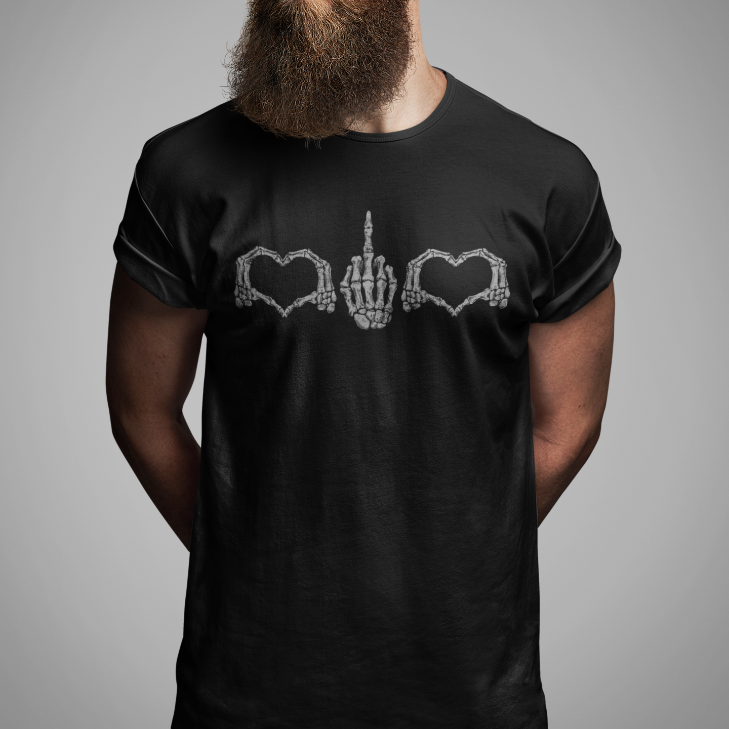 A man with a full beard and sunglasses wearing a black t-shirt with a white graphic of a hand between two hearts and the words 'GUEST KITCHEN GUEST'.