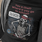 Person wearing a black t-shirt with a skeleton graphic and humorous text.
