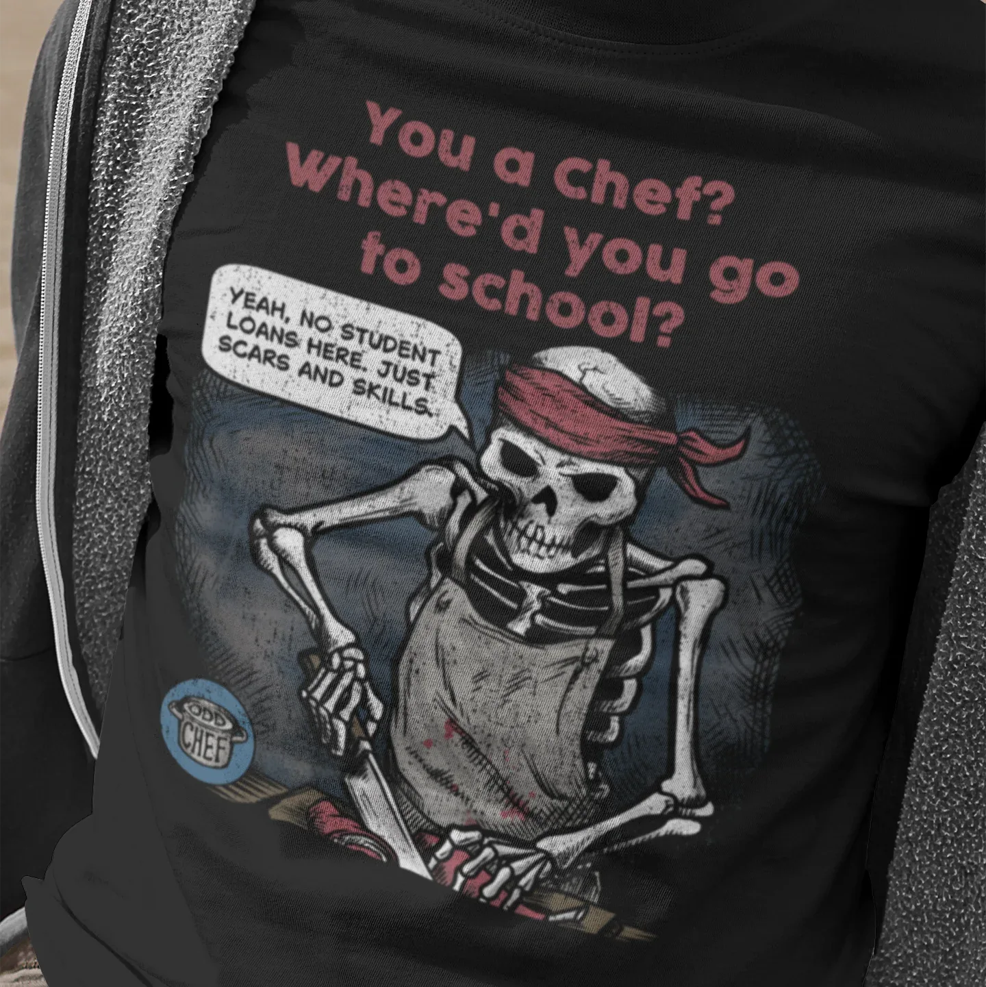 Person wearing a black t-shirt with a skeleton graphic and humorous text.