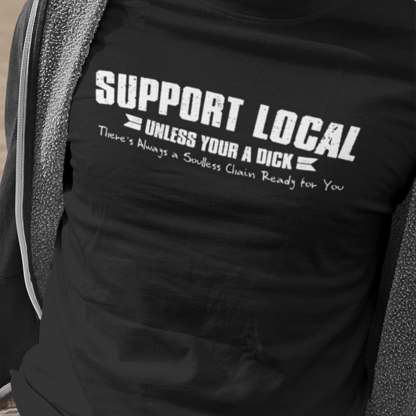 Person wearing a black t-shirt with humorous text design.