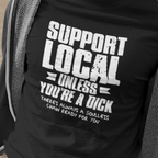 Person wearing a black t-shirt with 'Support Local Unless You're a Dick' text.