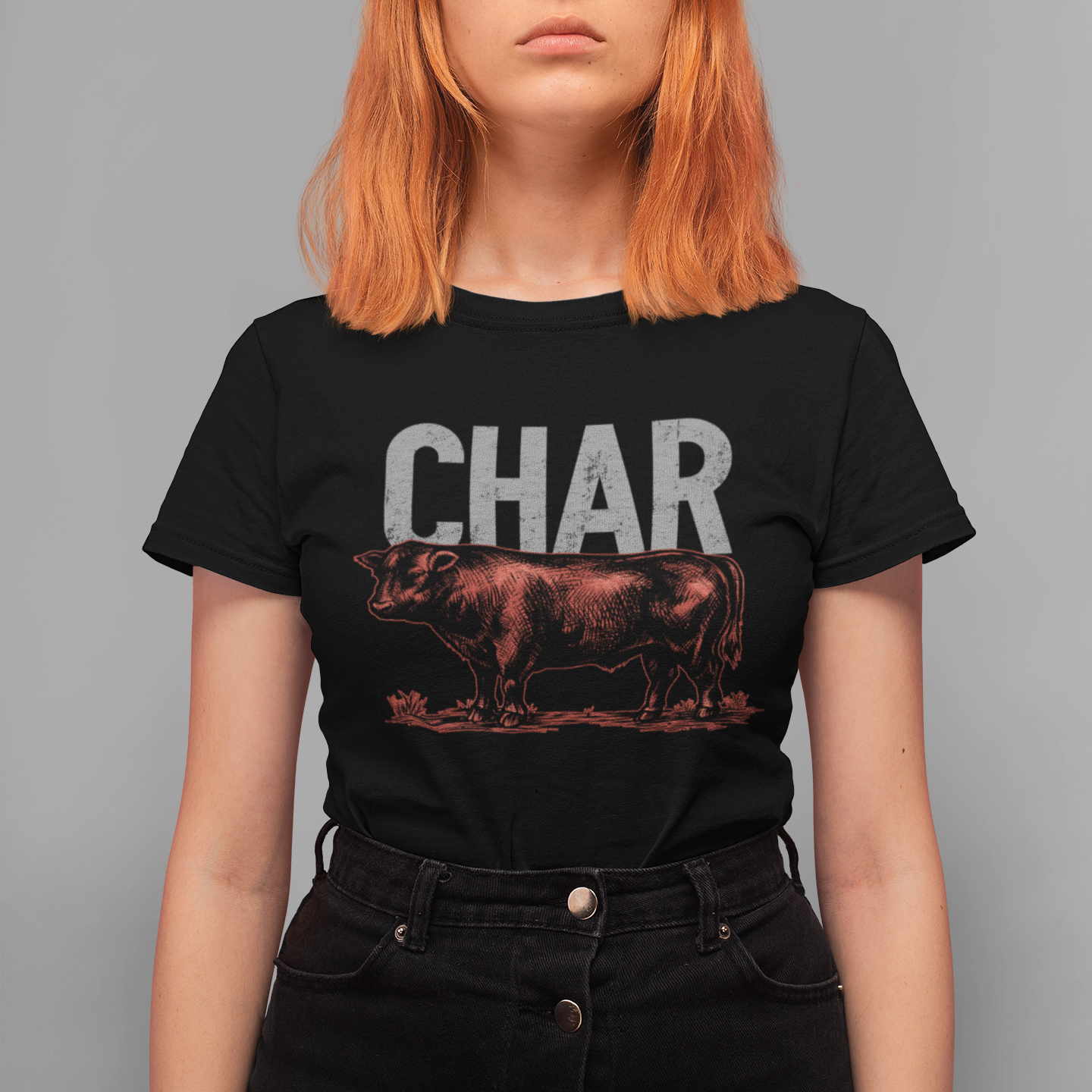 Person wearing a black t-shirt with 'CHAR' and a bull graphic on a gray background