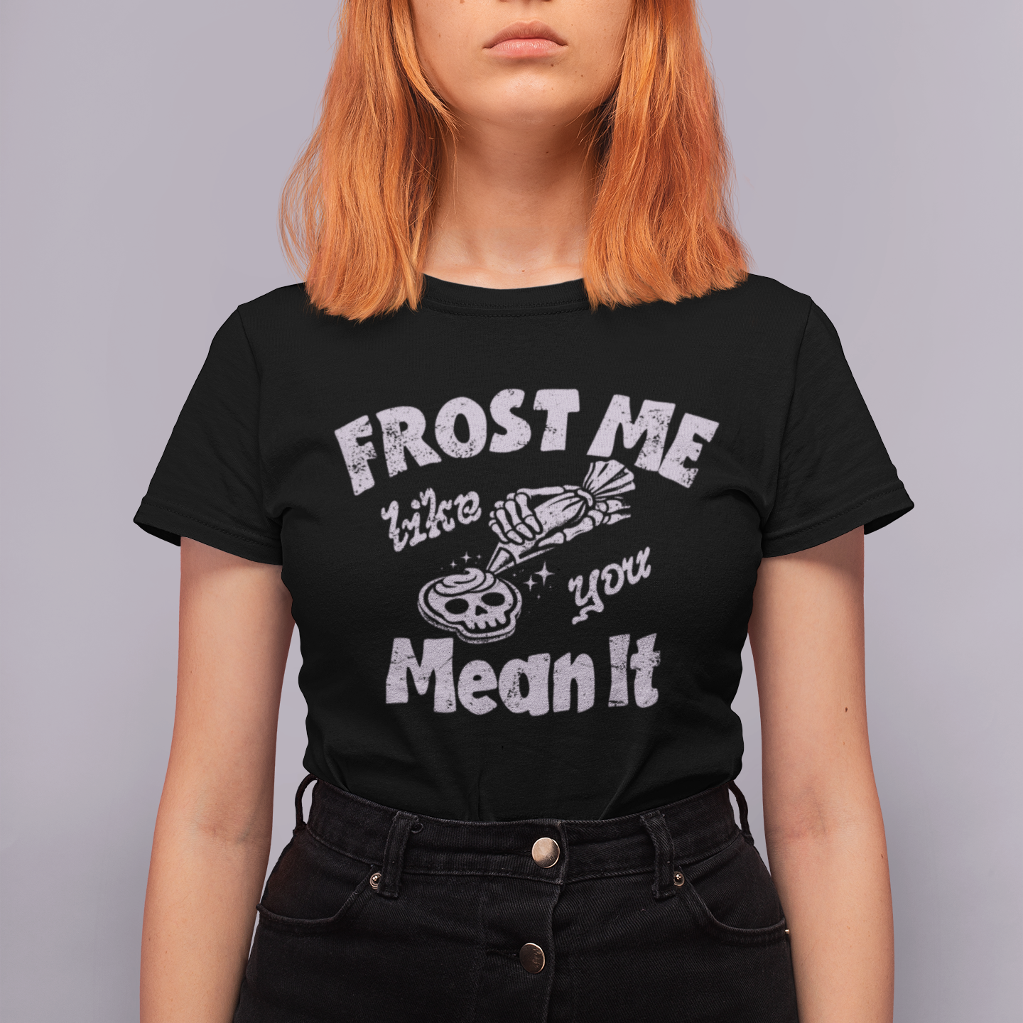 Person wearing a black t-shirt with white text against a gray background