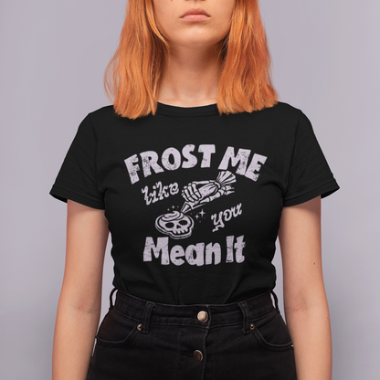 Person wearing a black t-shirt with white text against a gray background