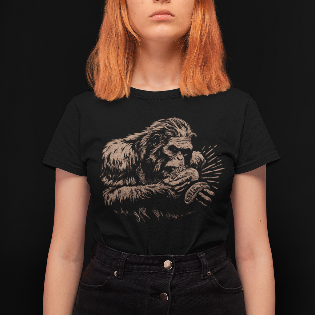 Person wearing a black t-shirt with a graphic design of a gorilla on a black background